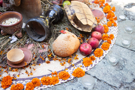 Offering with decorations and food for the day of the dead in the streets of the city of Oaxaca in Mexicoの写真素材