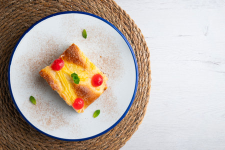 A traditional Catalan dessert similar to brioche with pastry cream and candied fruit. Top view table...