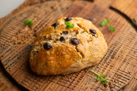 Triangular English scones with dark chocolate chips.