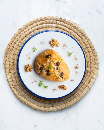 Triangular scones with dark chocolate chips. Top view table.の写真素材