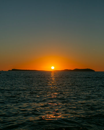 Beautiful sunset from Cafe Mambo in San Antonio Bay on the island of Ibiza in summer.の写真素材