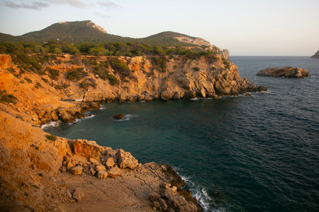 Wonderful cliffs overlooking the wild beach of Cala Sardina on the island of Ibiza.の写真素材