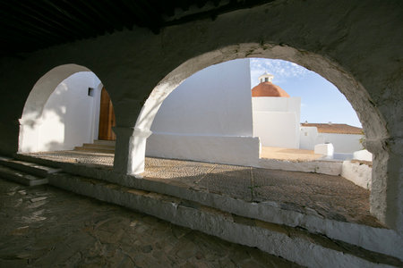 Beautiful white church of Puig de Misa in Santa Eulalia des Riu on the island of Ibiza.の写真素材