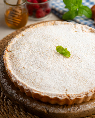 Nonna's Tart. Italian shortcrust pastry tart filled with lemon cream. Traditional recipe from the Italian nonna.の写真素材