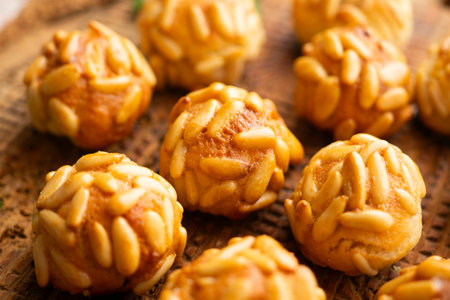 Panellets with pine nuts and almonds. A typical Catalan dessert made with marzipan and nuts.の写真素材