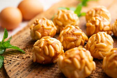 Panellets with pine nuts and almonds. A typical Catalan dessert made with marzipan and nuts.