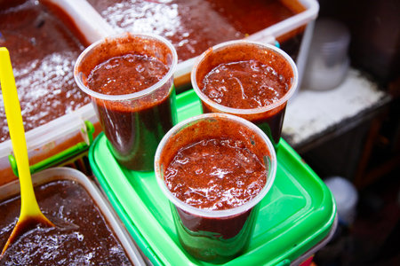 Chamoy, or a colorful michelada sauce, is sold at the San Juan Market in Mexico City.