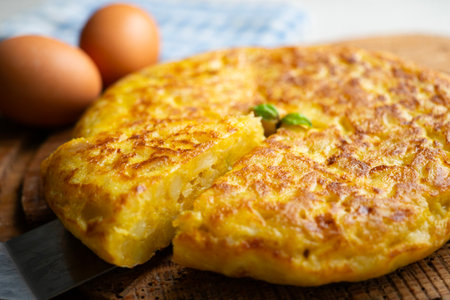 Traditional Spanish potato omelet. Step-by-step recipe to learn how to cook.の写真素材