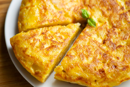 Traditional Spanish potato omelet. Step-by-step recipe to learn how to cook.の写真素材