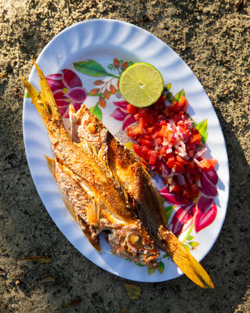 El Cuyo, Mexico; November 1, 2025: Fried fish at a restaurant in El Cuyo, a fishing village on Mexico's Yucatan Peninsula.の写真素材