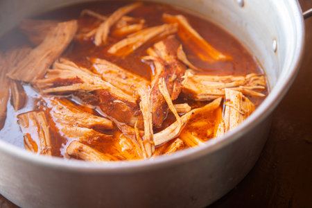Authentic cochinita pibil recipe in a dish and tacos typical of the Yucatan Peninsula in Mexico.