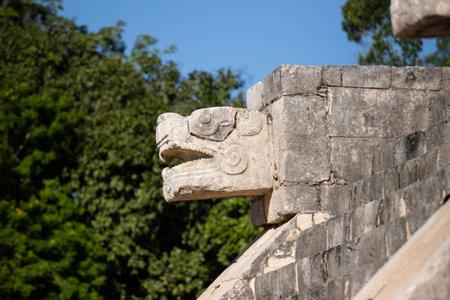 The iconic El Castillo pyramid, also known as the Temple of Kukulcan, stands majestically against a vibrant blue sky, showcasing its ancient Mayan architecture at Chichen Itzaの写真素材