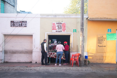 Valladolid, Mexico; 1st November 2025: Small taqueria with customers ordering food on a sunny day in Mexicoのeditorial素材