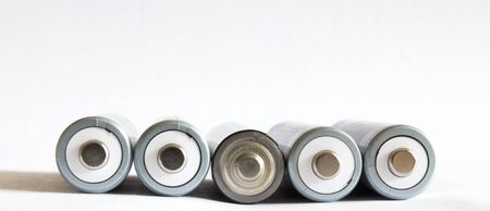 Five white AA rechargeble batteries isolated on white background