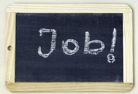 Job word written on a wooden framed blackboard with whiteの写真素材