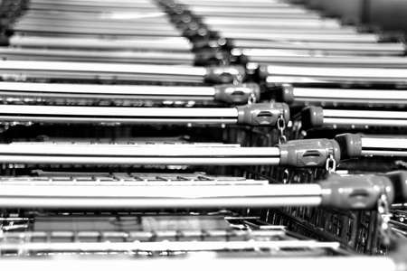 Bunch of shopping carts pulled up together in stackの写真素材