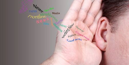 Adult male ear and hand listen to the news. News conceptの写真素材