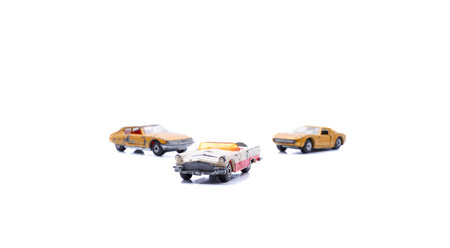 Various toy used retro toy cars isolated on white background