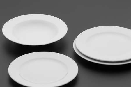 kitchen and restaurant utensils, plates, on a dark backgroundの写真素材