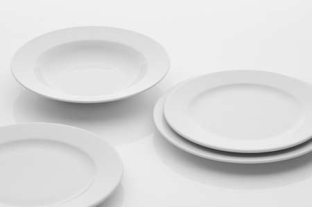 kitchen and restaurant utensils, plates, on a light backgroundの写真素材