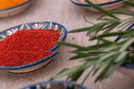 spices close up in a bowl and herbsの写真素材
