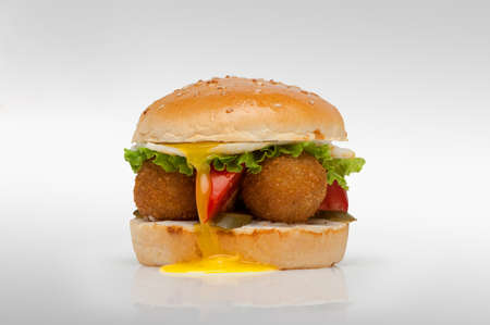 one cheeseburger close-up on a light backgroundの写真素材