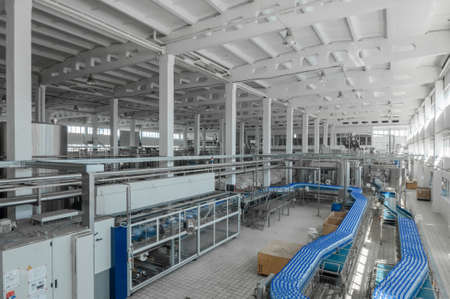 for the production of plastic bottles and bottles on a conveyor belt factoryの写真素材