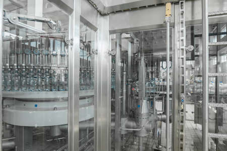 for the production of plastic bottles and bottles on a conveyor belt factoryの写真素材