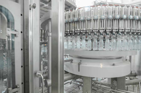 for the production of plastic bottles and bottles on a conveyor belt factoryの写真素材