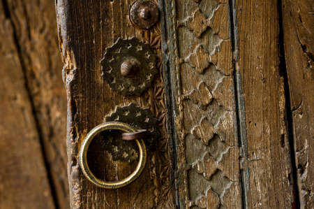 parts and elements of the old antique wooden door with a handleの写真素材