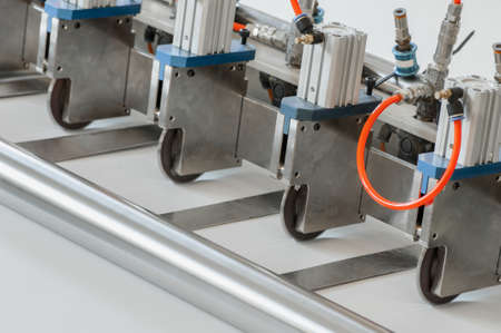 closeup of the machine and equipment are cut and furrowing the felt fabric for automotive filters