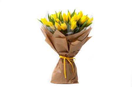 yellow tulips in a paper bouquet associated ribbon. Valentine's Day