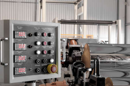 the control panel at the plant for the production of cellophane and polypropylene closeup. the dashboard in the workshop on the productionの写真素材