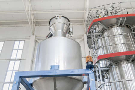 in factory industrial containers closeup. industrial tanks closeup view from below
