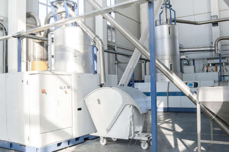 in the workshop machines for processing and manufacturing of plastic granules. a factory for processing plastic granules. PETの写真素材