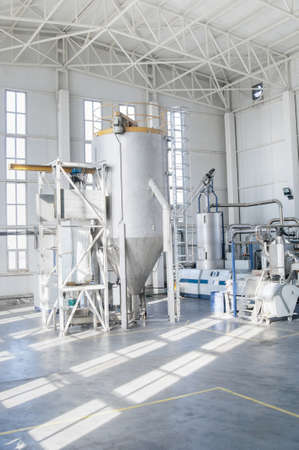 in the workshop machines for processing and manufacturing of plastic granules. a factory for processing plastic granules. PETの写真素材