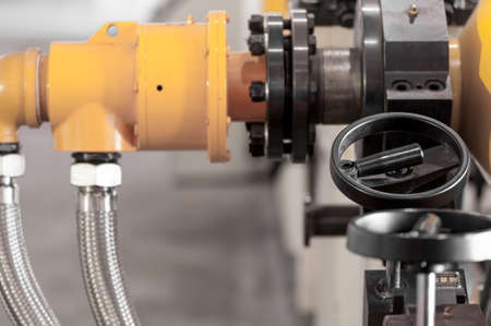closeup faucet with round handle for machine control
