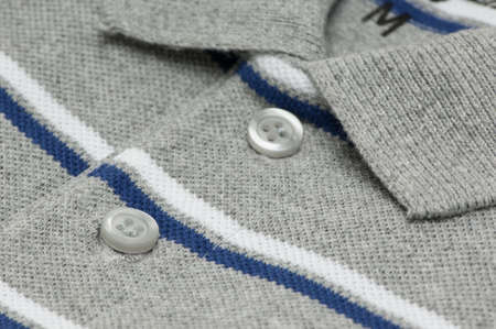 closeup t-shirt gray color and collar and buttons.