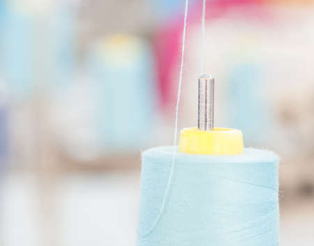 spool of thread close-up on a blurred background
