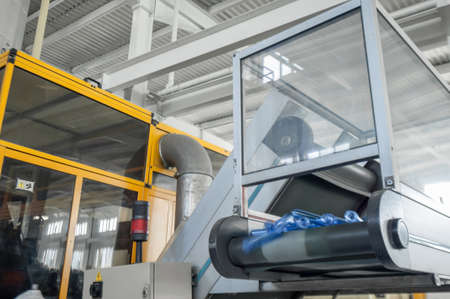 equipment for the manufacture of preforms for plastic bottles. PET production. on the conveyor the flask preform for plastic bottlesの写真素材