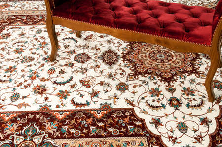 Antique sofa on the decorated oriental carpetの写真素材