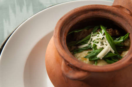 dish in a clay pot closeup