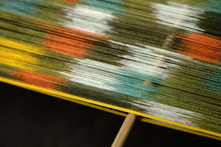 subtle silk weaving thread and yarn closeupの写真素材