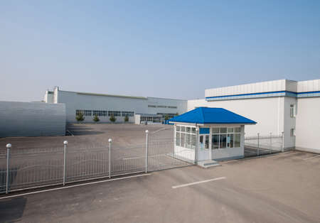 general view of the plant with a checkpoint and fence