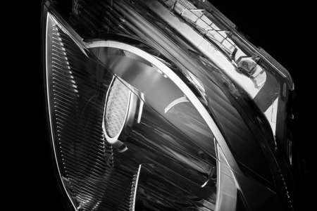 close-up of car lights on a black background isolated. trimmed car headlight