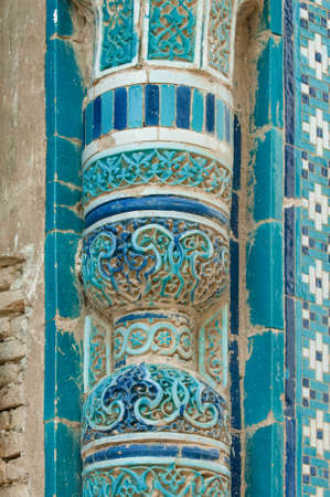 Closeup fragment of a column in the wall with the mosaic. the details of the architecture of medieval Central Asiaの写真素材