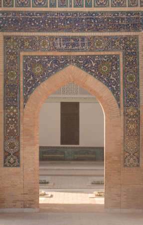 The arch and gates of the ancient Asian traditional ornament. the details of the architecture of medieval Central Asiaの写真素材