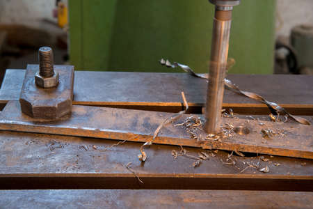 Drilling of the metal plate, close up