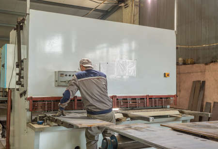 Worker is stand at the press form machine closed typeの写真素材