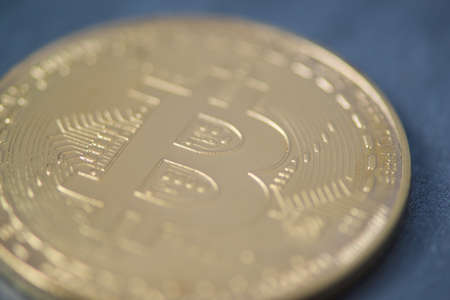 Golden bitcoin closeup, blurred photo. electronic moneyの写真素材